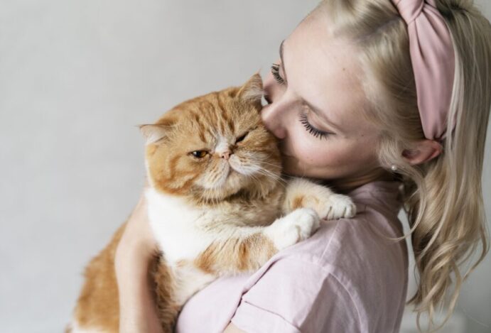 close-up-woman-kissing-cat